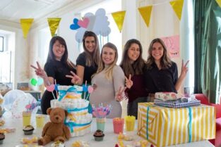 Colorful baby shower setup with smiling guests, showcasing FoodArt as one of the best catering services for baby showers in Bangalore.