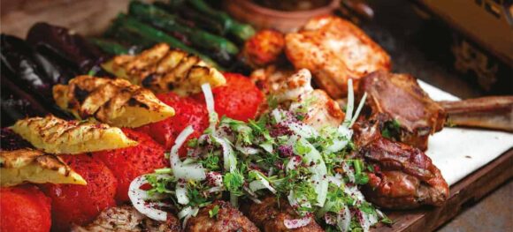 Delicious meats and veggies plated on a tray, part of a FoodArt recipe presentation.